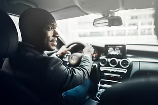 Taxi Driver Smiling A Passenger